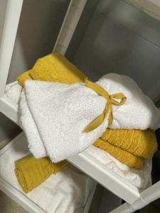 a bunch of towels with a yellow bow on them at Espectacular piso en la playa in Gijón +34 photos