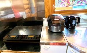 Een keuken of kitchenette bij on a journey 千葉 九十九里