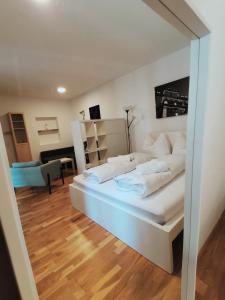 a bedroom with a large white bed in a room at City Center Golden Roof 8 in Innsbruck