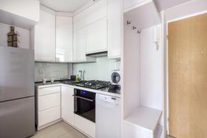 Kuchyňa alebo kuchynka v ubytovaní Labo Apartment Ogrodowa