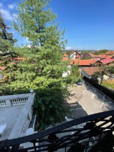 a view from the balcony of a house with a tree at Vila Grinka M in Zaječar