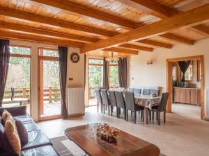 a living room with a table and chairs at Orion in Borzont