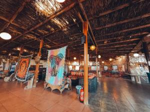 a large room with tables and chairs in a building at Safari Beach Nuweiba in Nuweiba