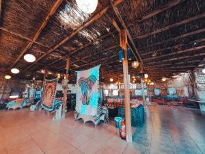 a room with tables and chairs in a building at Safari Beach Nuweiba in Nuweiba