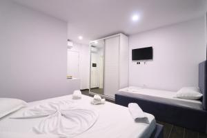 Memi Hotel客房内的一张或多张床位