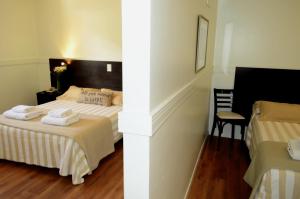 Cama ou camas em um quarto em Abril Hotel Boutique