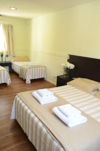 Cama ou camas em um quarto em Abril Hotel Boutique