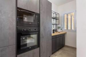 Kuchyň nebo kuchyňský kout v ubytování Home Paradise