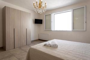 Postel nebo postele na pokoji v ubytování Home Paradise
