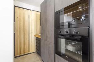 Kuchyň nebo kuchyňský kout v ubytování Home Paradise
