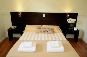 Cama ou camas em um quarto em Abril Hotel Boutique