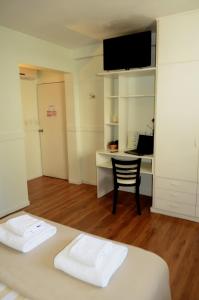 Cama ou camas em um quarto em Abril Hotel Boutique