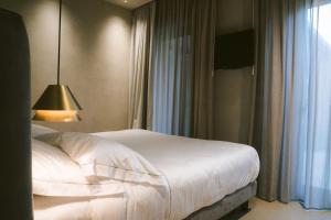 Postel nebo postele na pokoji v ubytování Villa Grumolara & Spa