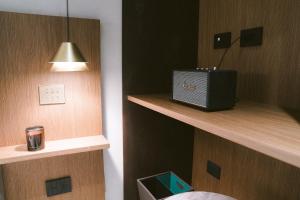 a room with a shelf with a box on it at VILLA GRUMOLARA in Lamezia Terme