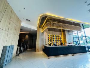 a lobby of a restaurant with a counter and a bar at The Cam Ranh Oceanview Resort in Cam Ranh