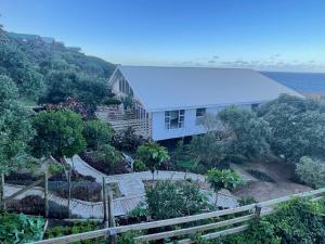 a house on top of a hill next to the ocean at Villa 9B Signal Hill Ponta Malongane in Ponta do Ouro