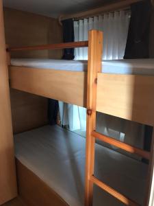 a couple of bunk beds in a room at Agri Camping italiano - Eucalyptus in Shënkoll
