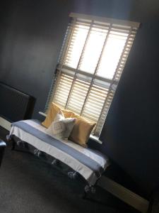 Una cama o camas en una habitación de Raby Apartment
