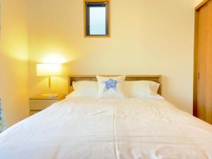 Letto o letti in una camera di 浜町小院别馆