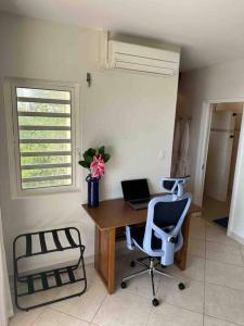 a office with a desk with a laptop and a chair at Villa Sea Forever @ Pelican Key - Paradise Awaits! in Simpson Bay