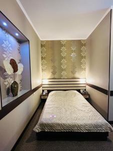 Posteľ alebo postele v izbe v ubytovaní Classic Hotel