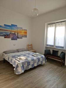 Ένα ή περισσότερα κρεβάτια σε δωμάτιο στο Susy's Home Appartamento in centro +16 φωτογραφίες