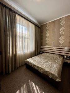 Posteľ alebo postele v izbe v ubytovaní Classic Hotel