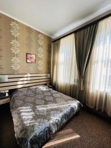 Posteľ alebo postele v izbe v ubytovaní Classic Hotel