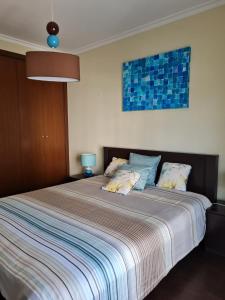 Postel nebo postele na pokoji v ubytování Marina Terrace - A045