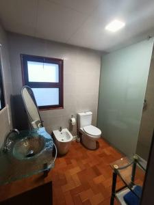 a bathroom with a sink and a toilet at Apartamento Casa de pueblo in Sant Feliu de Guixols