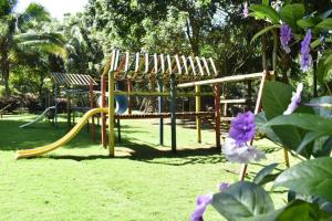 a playground with a slide in a park at Malía Casa Campo in Santa Marta