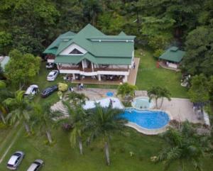 an aerial view of a house with a swimming pool at Malía Casa Campo in Santa Marta +22 photos