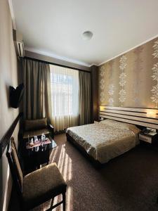 Posteľ alebo postele v izbe v ubytovaní Classic Hotel
