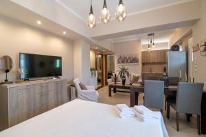 a large room with a dining room and a living room at Joanna Luxury Apartment in Preveza