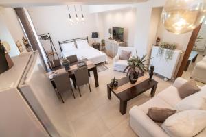 a living room with a couch and a table at Joanna Luxury Apartment in Preveza
