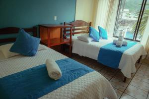 Voodi või voodid majutusasutuse Hostal CañaLimeña toas