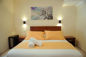 Voodi või voodid majutusasutuse Hostal CañaLimeña toas