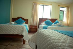 Voodi või voodid majutusasutuse Hostal CañaLimeña toas