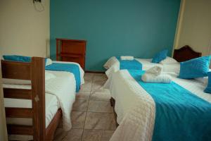 Voodi või voodid majutusasutuse Hostal CañaLimeña toas