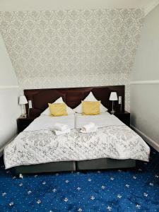 Postel nebo postele na pokoji v ubytování Gala Hotel
