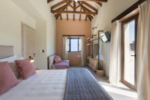 a bedroom with a large bed and a large window at Sea View Villa Mia Casa with Private Pool, Ping-Pong & BBQ in Langá