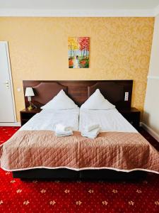 Postel nebo postele na pokoji v ubytování Gala Hotel