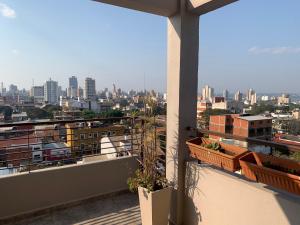 a view of a city skyline from a balcony at Loft Pedro Méndez 20408C in Posadas