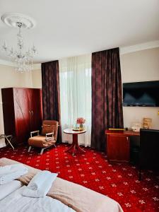 Postel nebo postele na pokoji v ubytování Gala Hotel