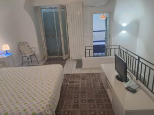 Postel nebo postele na pokoji v ubytování DreamHouse Nonno Enio - Forio d'Ischia + 37 fotografií