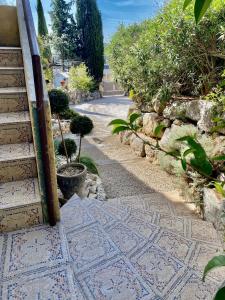 a stairway with a mosaic floor and a stair case at Studio entre Aix en Provence et Marseille et parking in Septèmes-les-Vallons