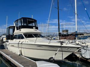 a white boat is docked at a dock at Private Yacht in San Francisco in San Francisco