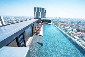 a swimming pool on the top of a building at Sea View 2 Bed Room Condo @ Central Pattaya in Pattaya Central
