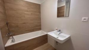 a bathroom with a sink and a bath tub at 2 room Apartment Rovinka, 204 in Rovinka +12 photos
