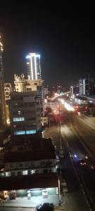 a city at night with buildings and street lights at Mima's Apartment in Dar es Salaam